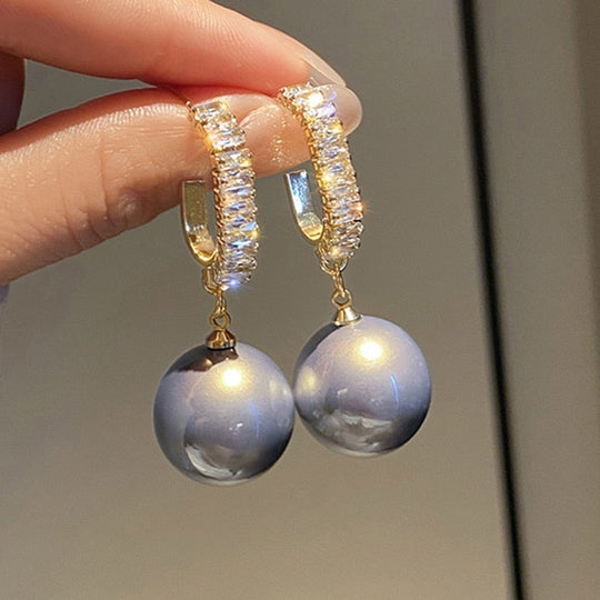 Luksuriøse øreringe med elegant perle og zirkonia