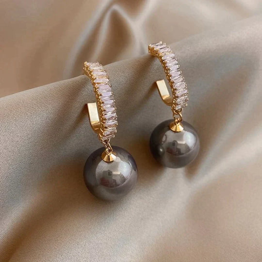 Luksuriøse øreringe med elegant perle og zirkonia